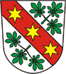 Wappen von Wansdorf: In Silber ein mit drei goldenen Sporenrädern belegter roter Schrägrechtsbalken, beseitet von zwei auswärts gekehrten dreiblättrigen grünen Kastanienzweigen